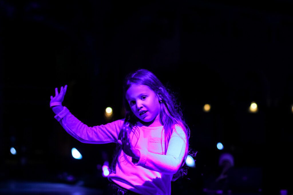 girl dancing in neon light